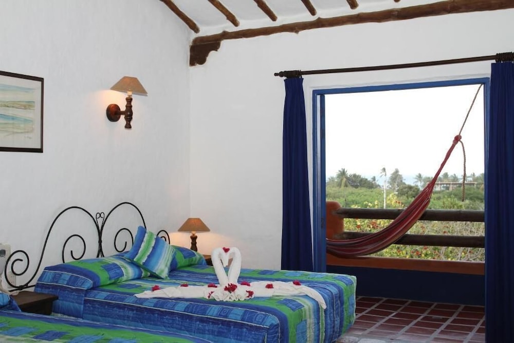 Deluxe Quadruple Room, 2 Queen Beds, Balcony, Resort View