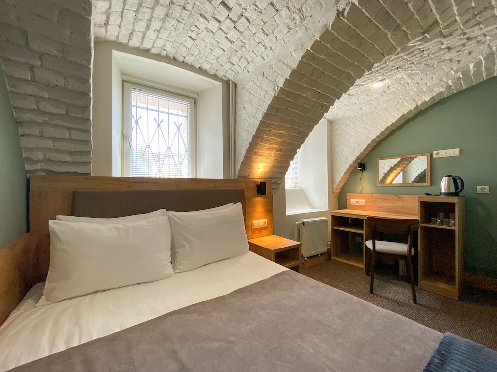 A standard double room with one bed in the basement