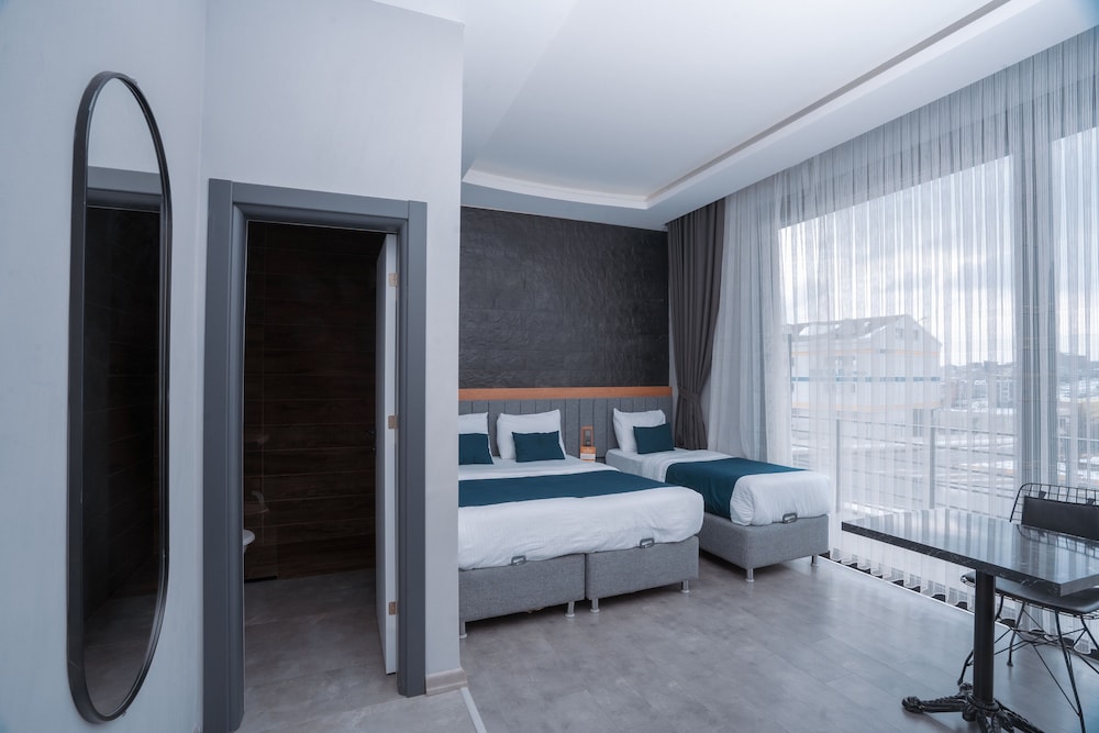 Deluxe Triple Room - Photo 11