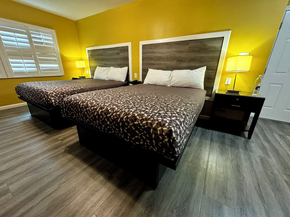 Double Queen Bedroom with Fireplace: Partial Ocean View - Photo 1