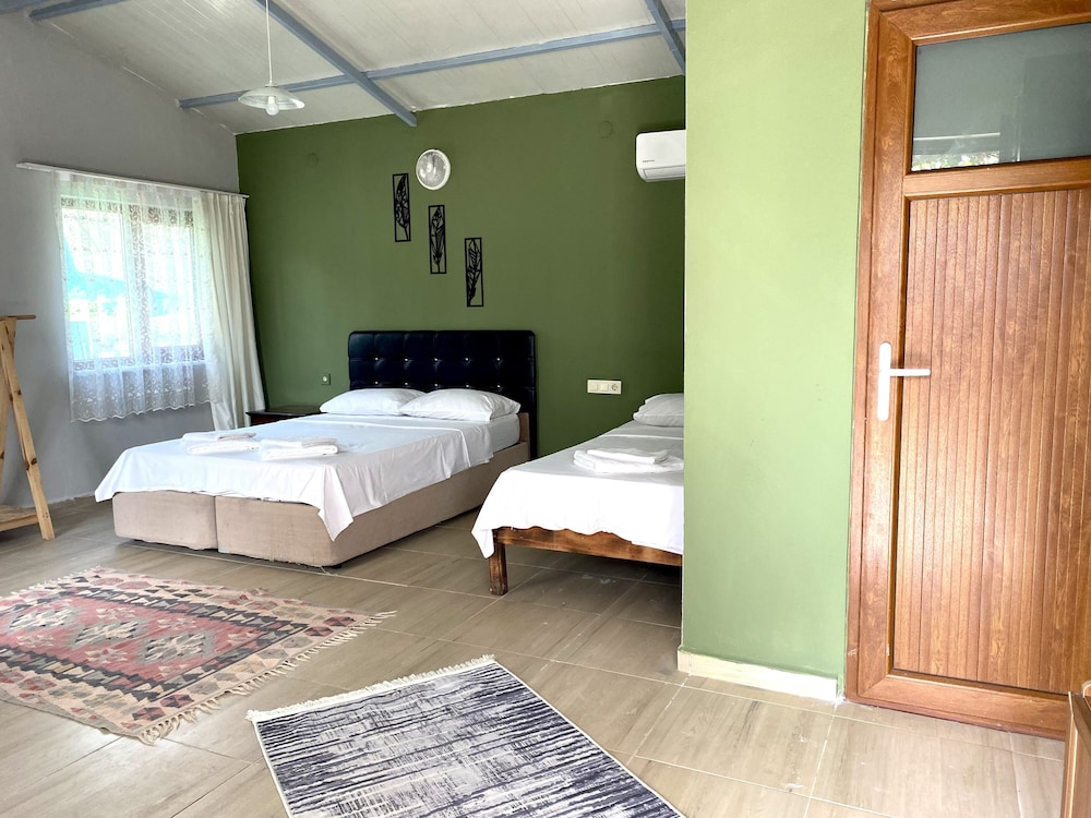 Family Triple Room, Multiple Beds, Patio, Garden View photo 1