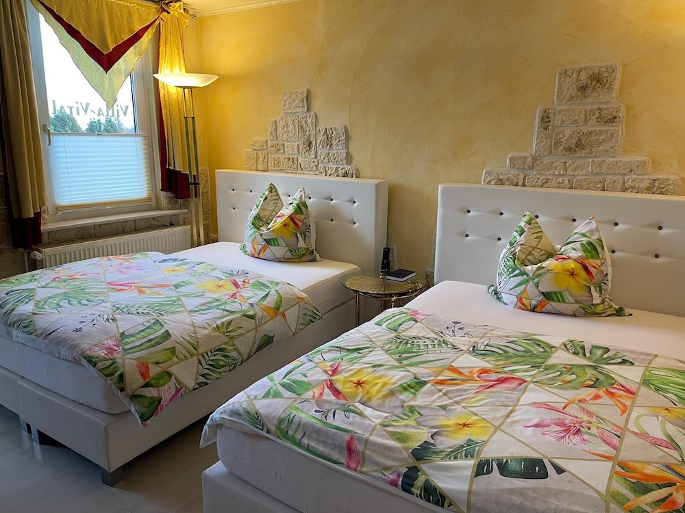 Deluxe Quadruple Room, 2 Queen Beds photo 1