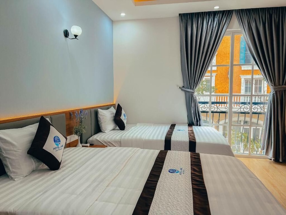 Deluxe Quadruple Room, Balcony, City View