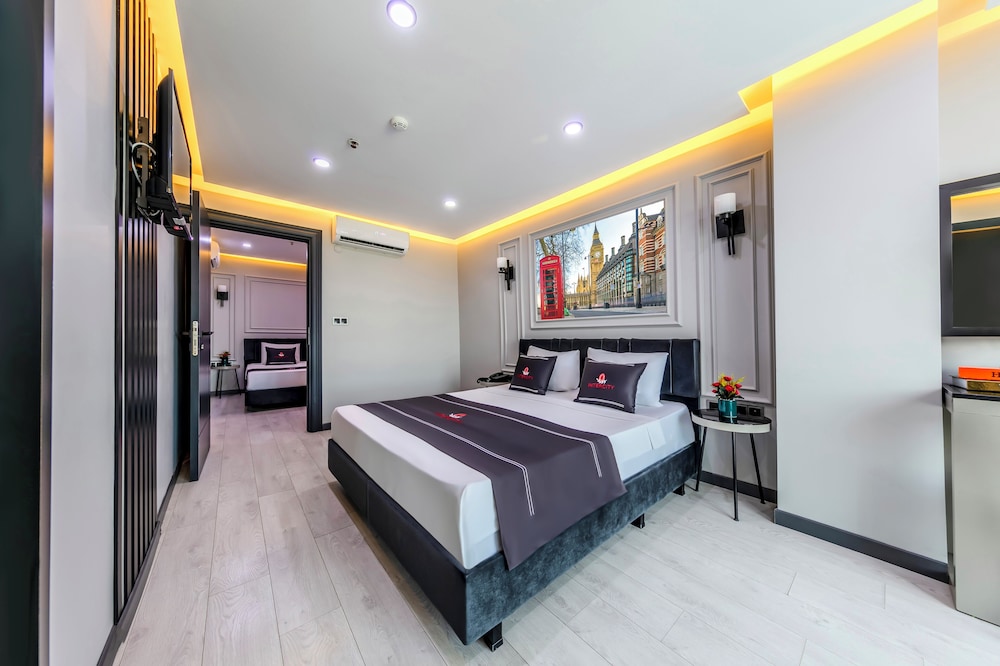 Deluxe Triple Room - Photo 1