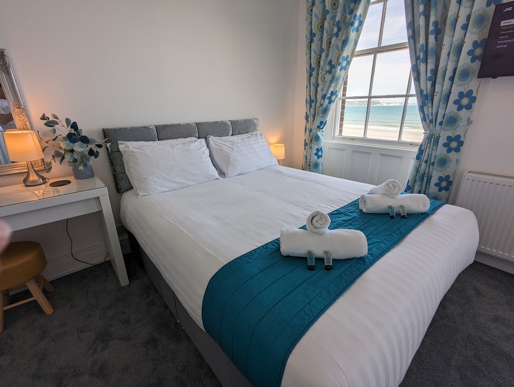 Triple Room, Multiple Beds, Beach View photo 1