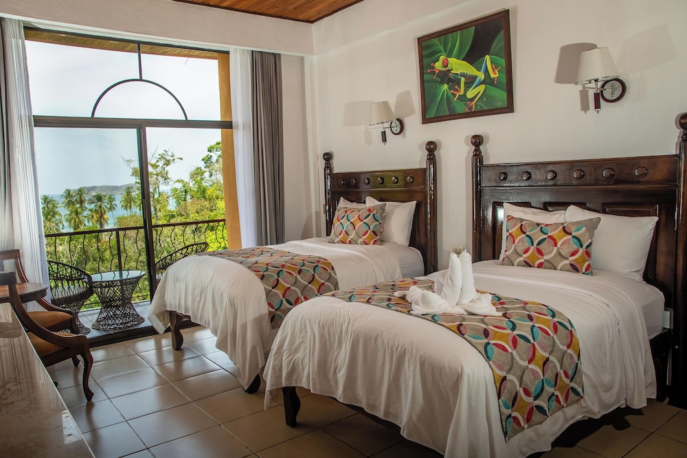 Deluxe Room with Partial Ocean View Two Beds - Photo 2
