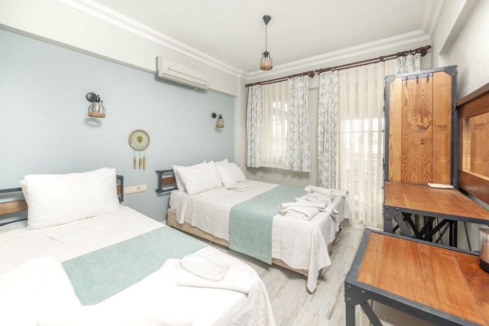 Deluxe Triple Room, Balcony, Garden View