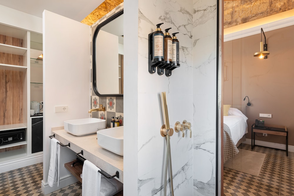 bathroom with two sinks and a large mirror on the wall