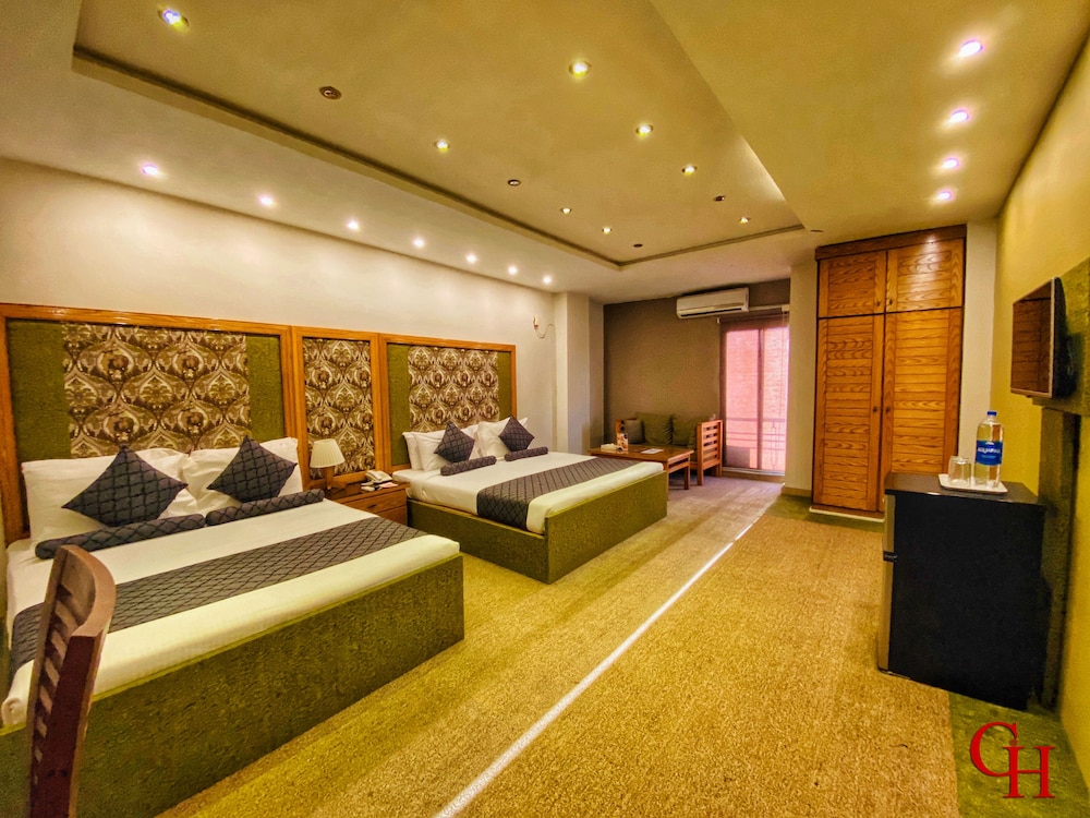 Family Quadruple Room, 2 Queen Beds, City View, Executive Level photo 2