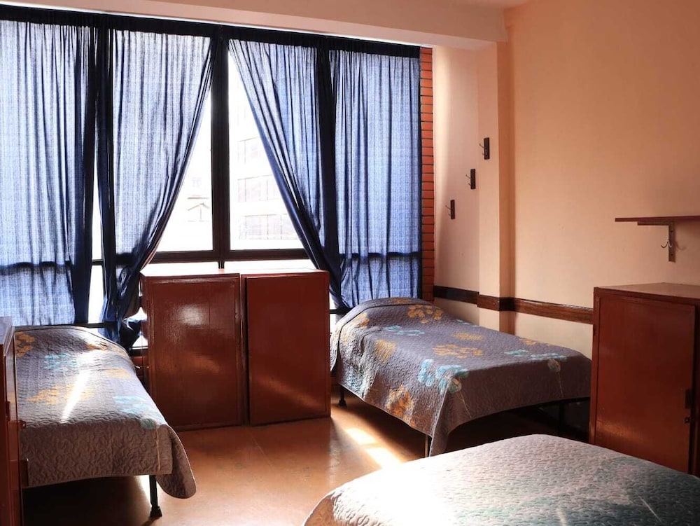 Bed on Mixed Shared Dormitory Quadruple, Shared Bathroom photo 3