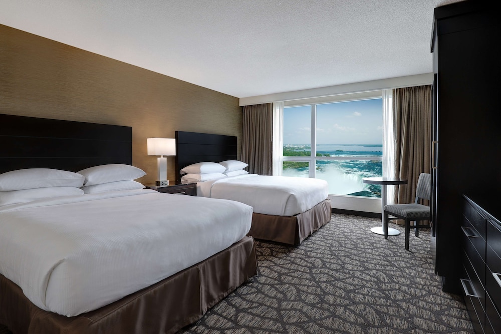 2 Queen Beds with Sofa Bed and partial view of Niagara Falls - Floors 10-25