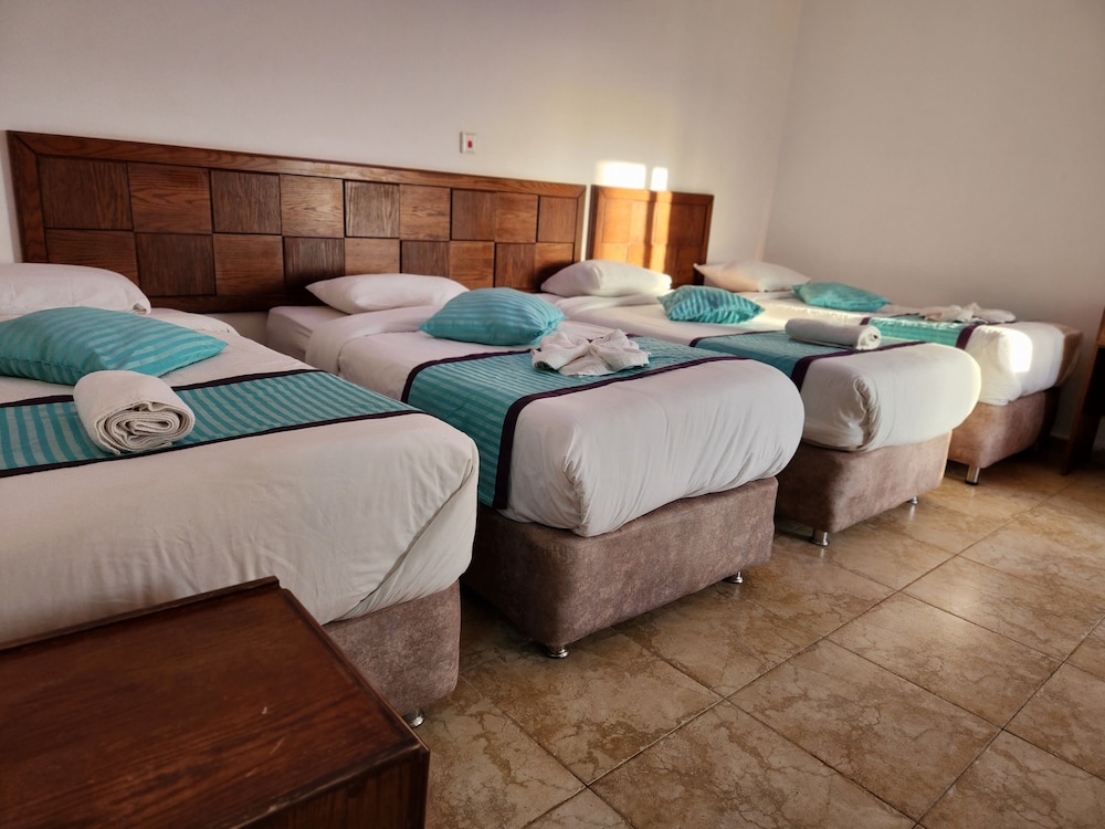 Deluxe Quadruple Room, 1 Bedroom, Balcony, Poolside photo 1