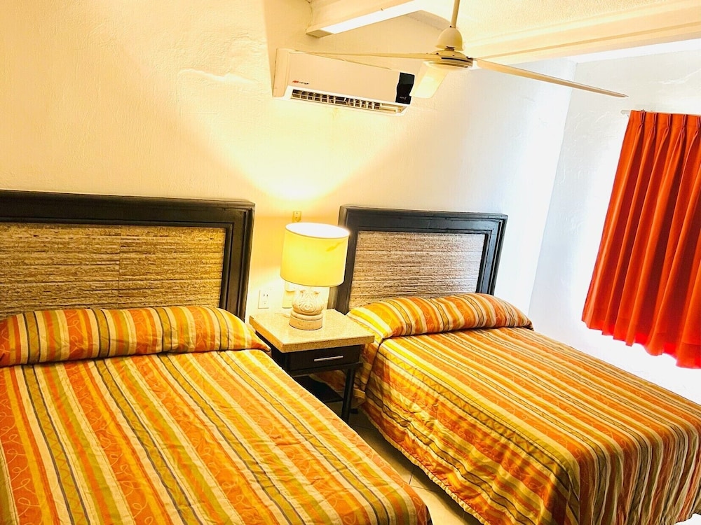 Habitación dos matrimoniales frente a playa, photo 6