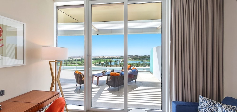 One Bedroom Terrace Suite with Access to Lounge, 3 Pools & Mall Shuttle