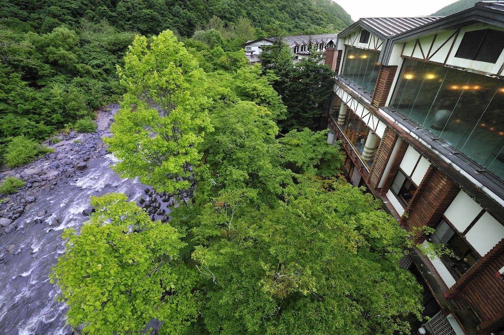 Outdoor bath with mountain stream side tatami room photo 2