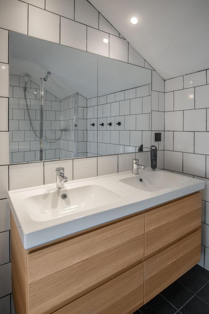 Relax in this modern, spacious bathroom oasis.
