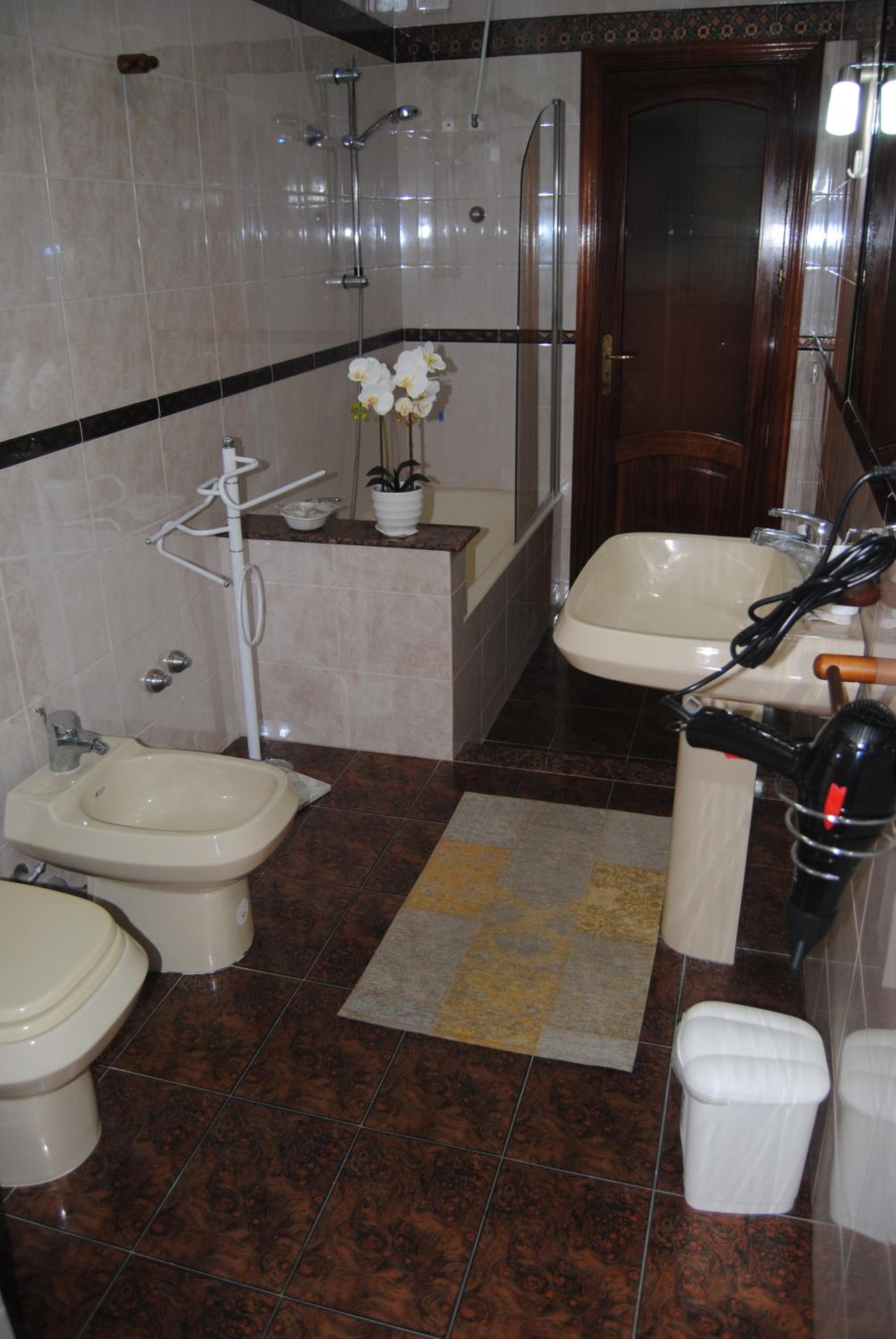 Three-Bedroom Apartment - Photo 13