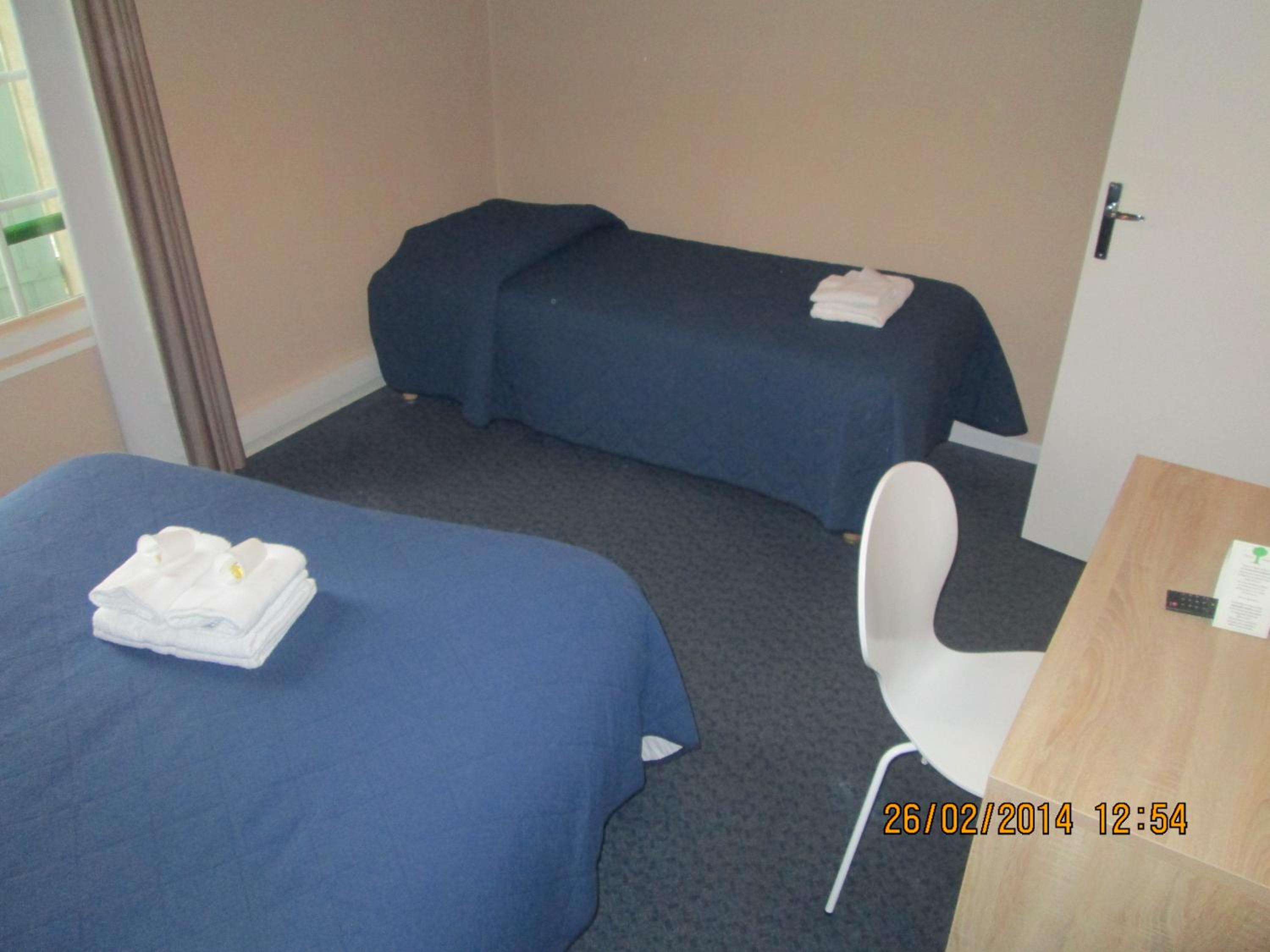 Standard Triple Room (private toilets and bathroom)