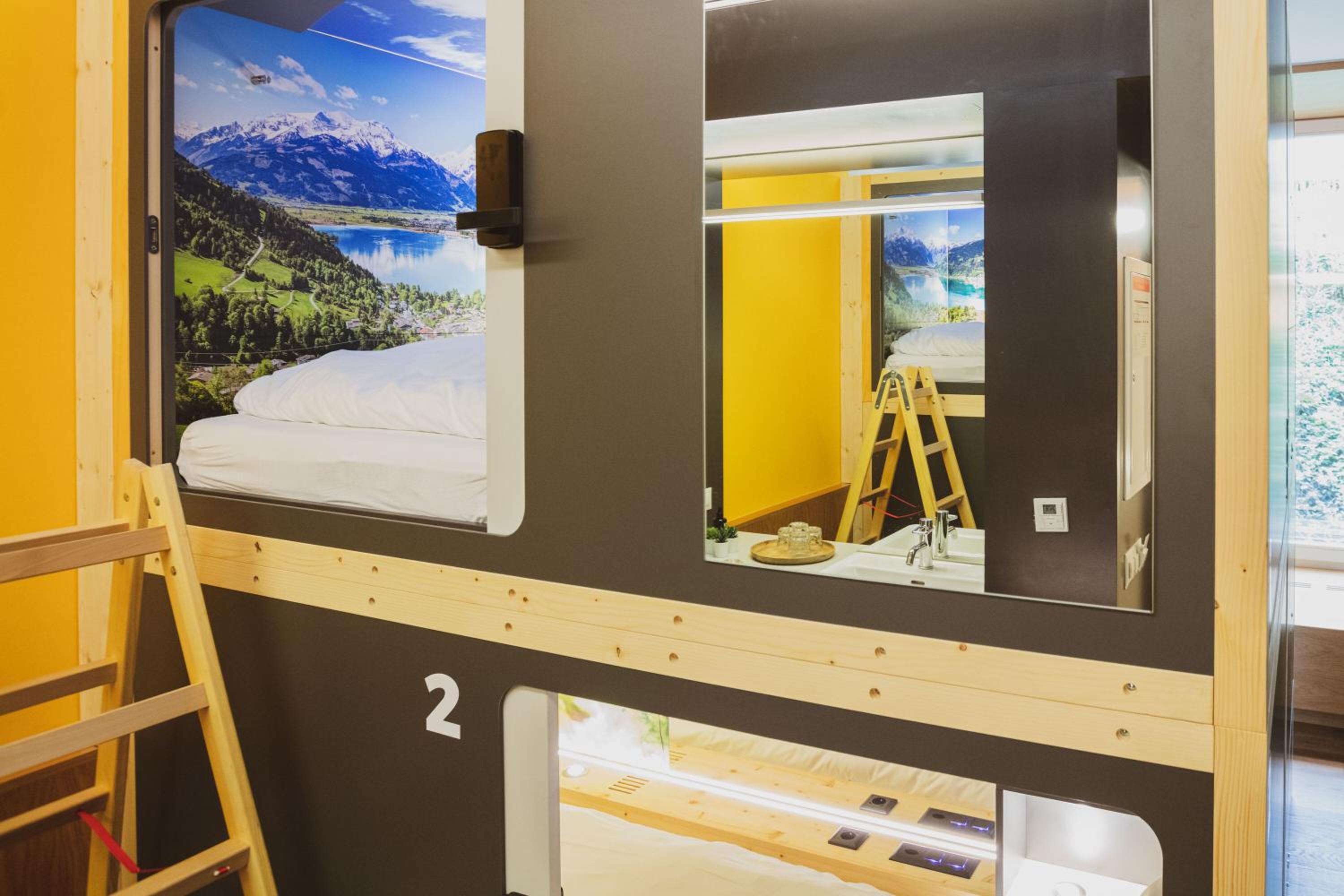 Swiss Forest Room with 4 Capsule Beds with shared bathroom
