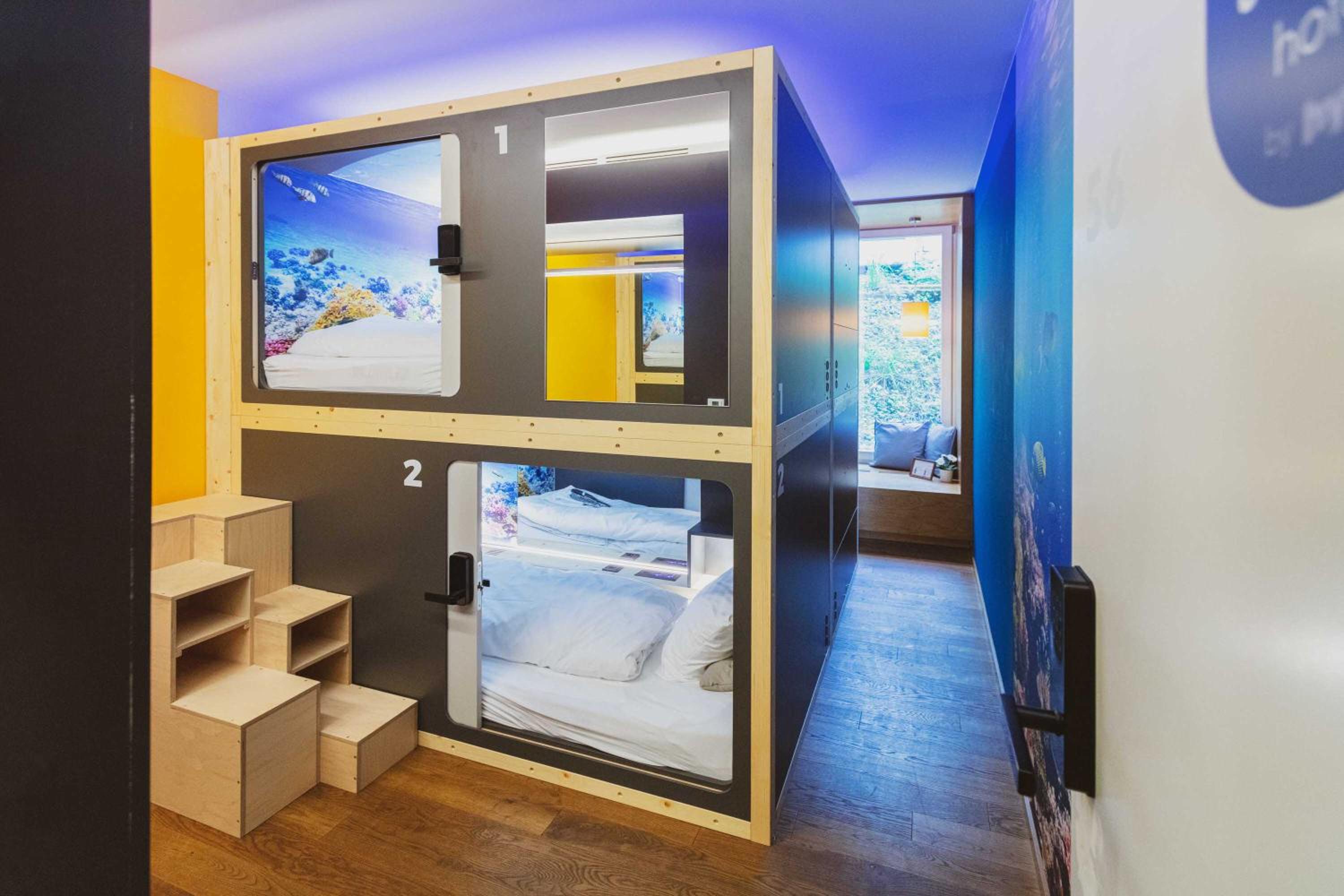Underwater World Room with 4 Capsule Beds with shared bathroom