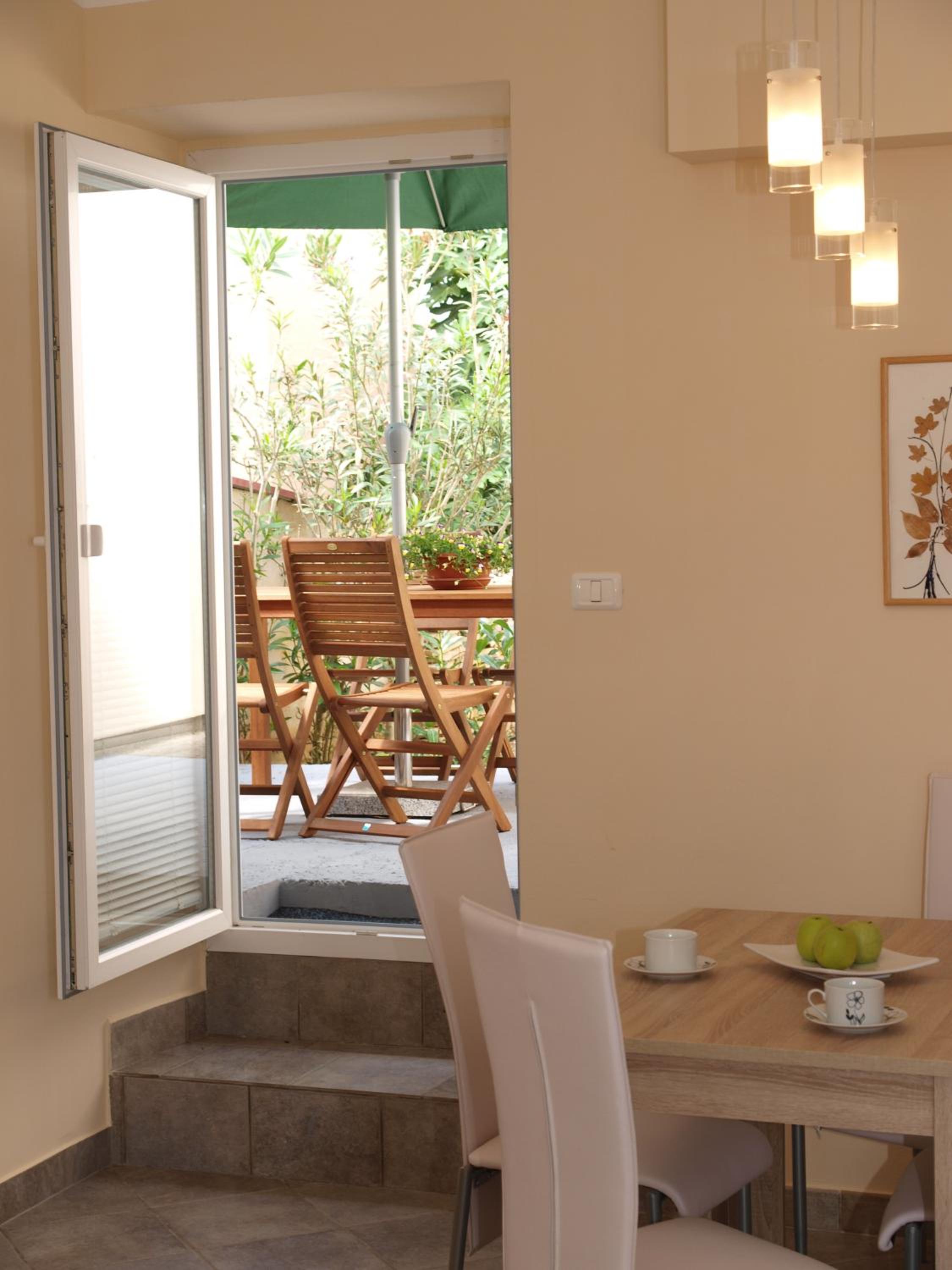 One-Bedroom Apartment with Terrace and Garden View