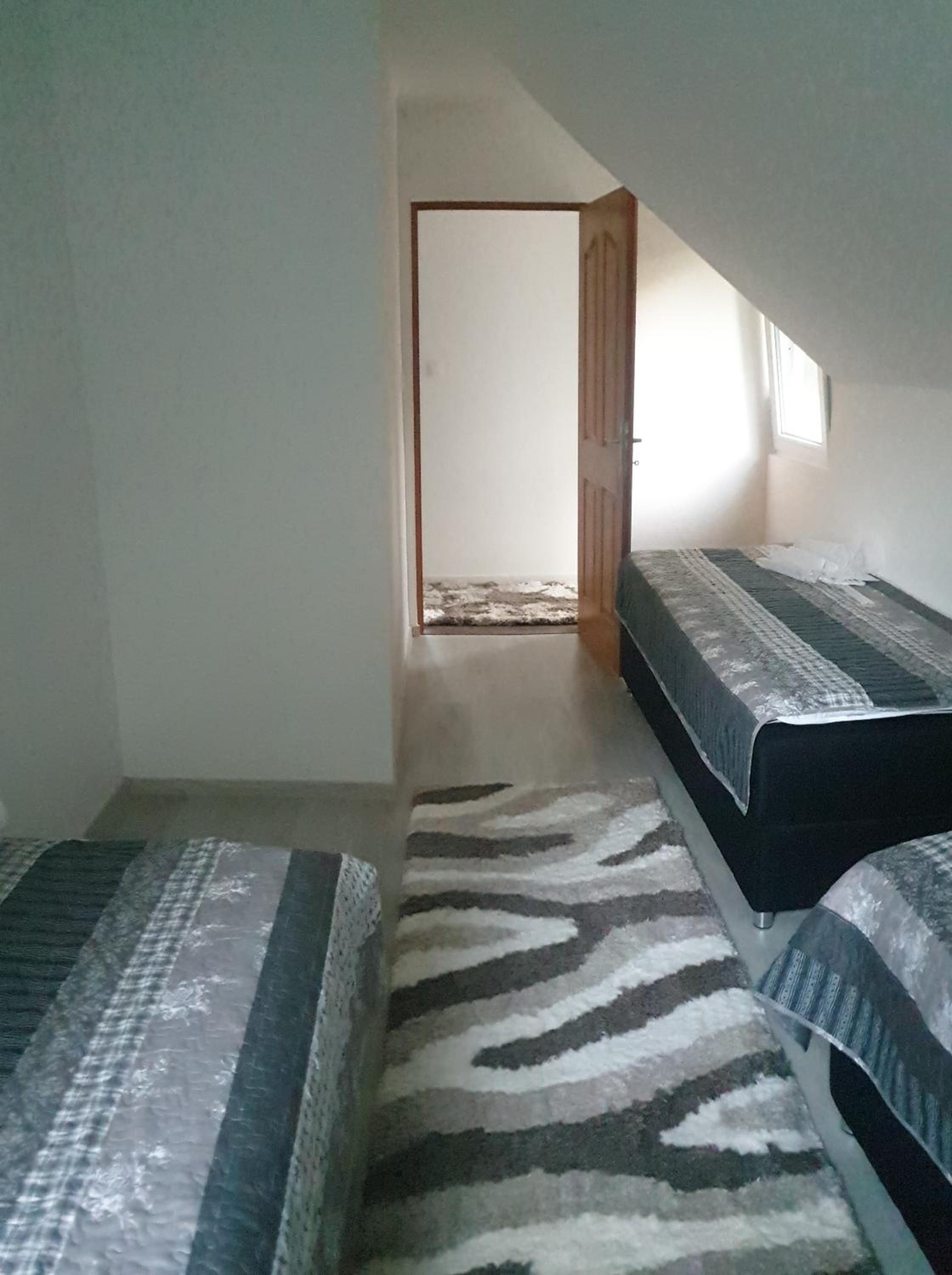 Three-Bedroom House - Photo 2
