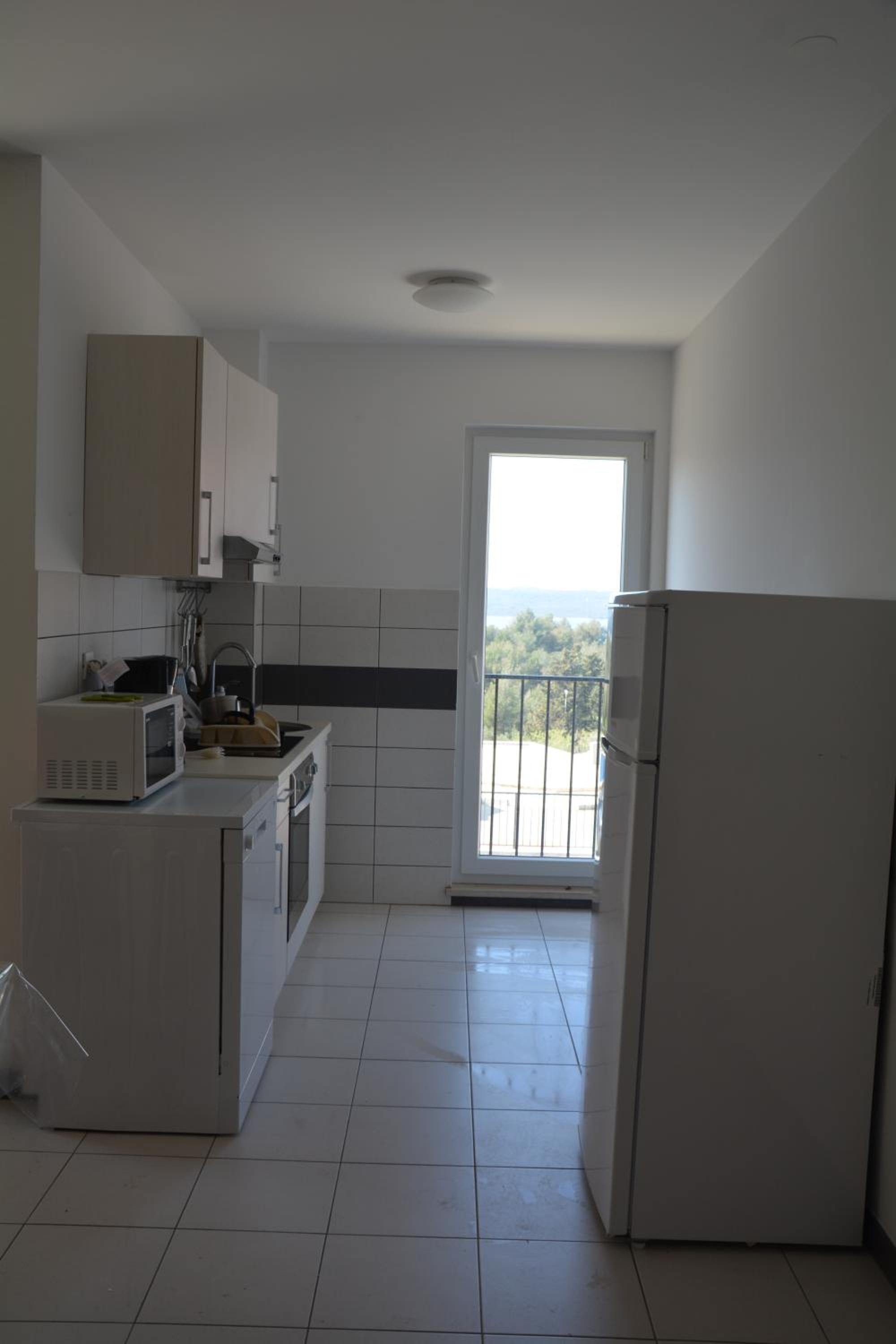 Comfort Two-Bedroom Apartment with Balcony and Sea View - Photo 15