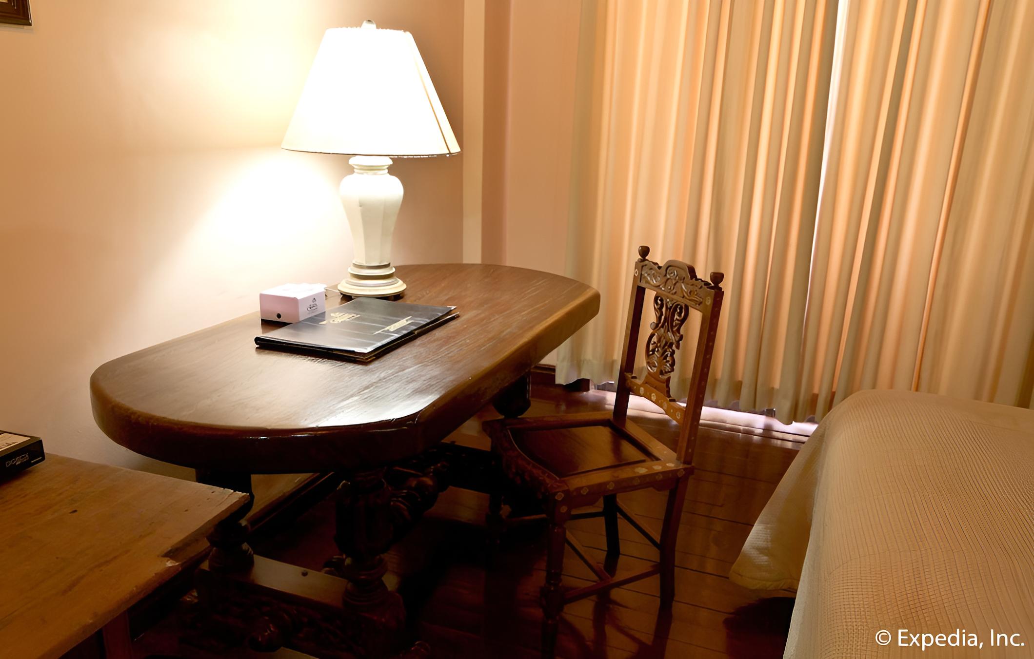 table with books and lamp on it? i think